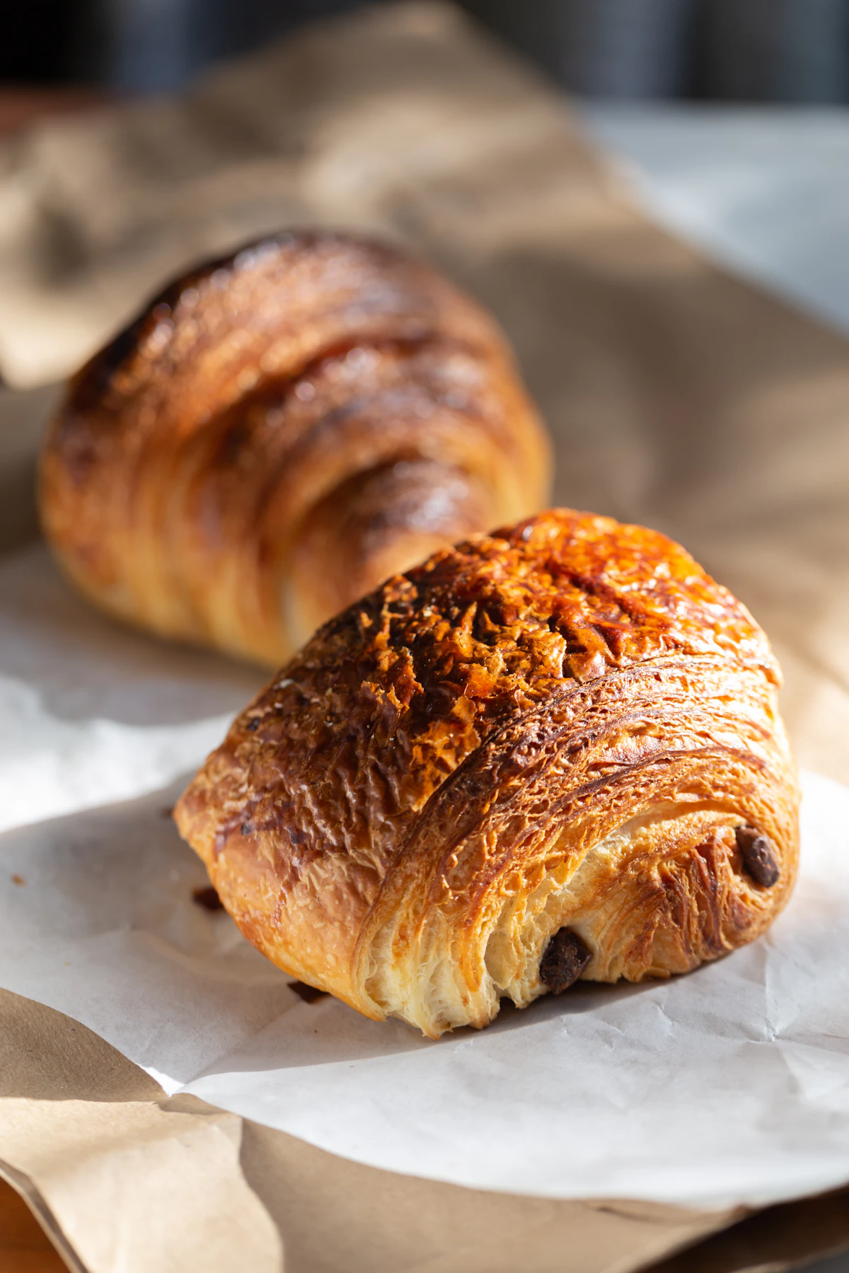 Croissants resting on white paper